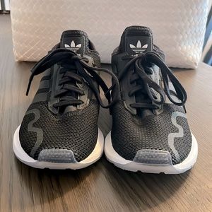 New Adidas! Black and white: women’s size 7.5.